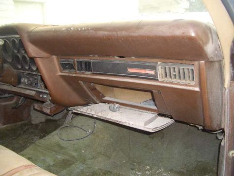 1974 Ford Ranchero - Interior view of a car's dashboard, showing the glove compartment and air vents.