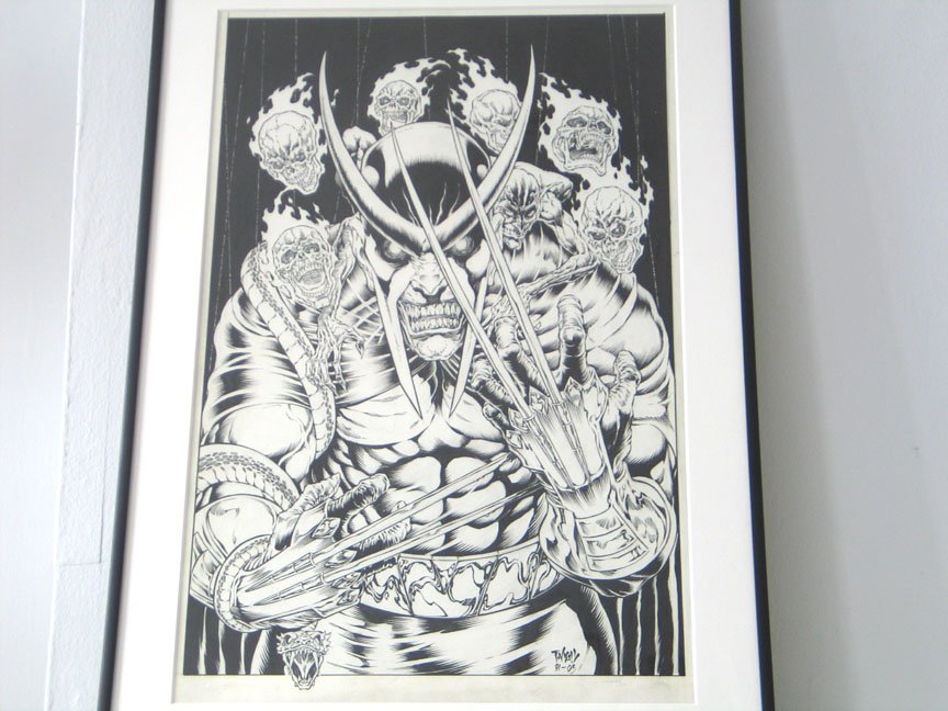 Framed comic art of Wolverine with flaming skulls behind him