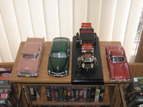 1988 Mercury Grand Marquis - (left to right) 55 chevy, 49 Merk, Munster car, 62 Vette