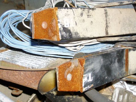 1967 Ford Bronco - The image shows a close-up view of rusty metal components and a tangle of electrical wires.
