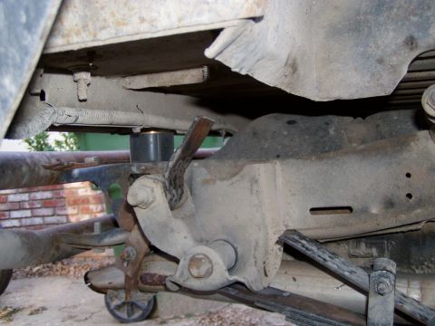 1967 Ford Bronco - Close-up view of a vehicle's undercarriage, showing suspension parts and leaf springs.