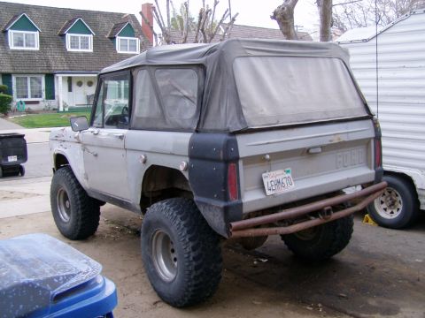 1967 Ford Bronco - This 1967 Ford Bronco features a soft top and is seen from the rear with its California license plate visible.
