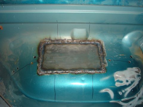 1996 Ford Bronco - Welded patch on the floor of a 1996 Ford Bronco, likely for rust repair.