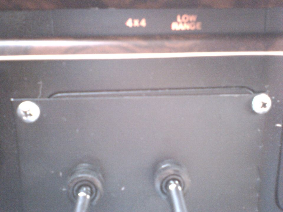 Dashboard with 4x4 and LOW RANGE labels above two levers