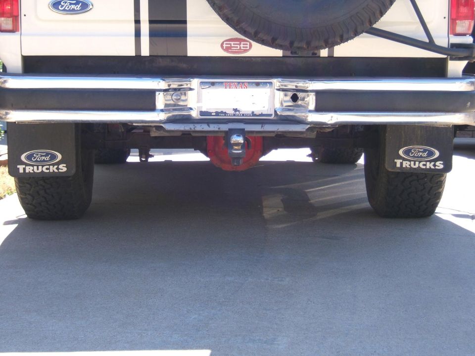Rear bumper underside of a Ford truck with Ford Trucks mud flaps