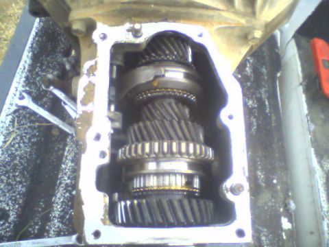 1985 Ford Bronco - The internal gears of a vehicle's transmission are visible after the casing has been opened.