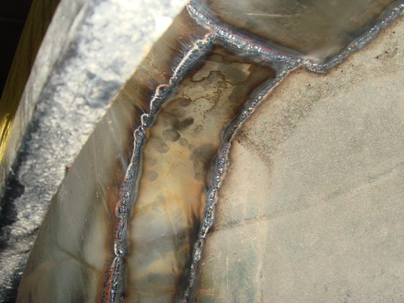 Welded metal with visible seams and discoloration from heat