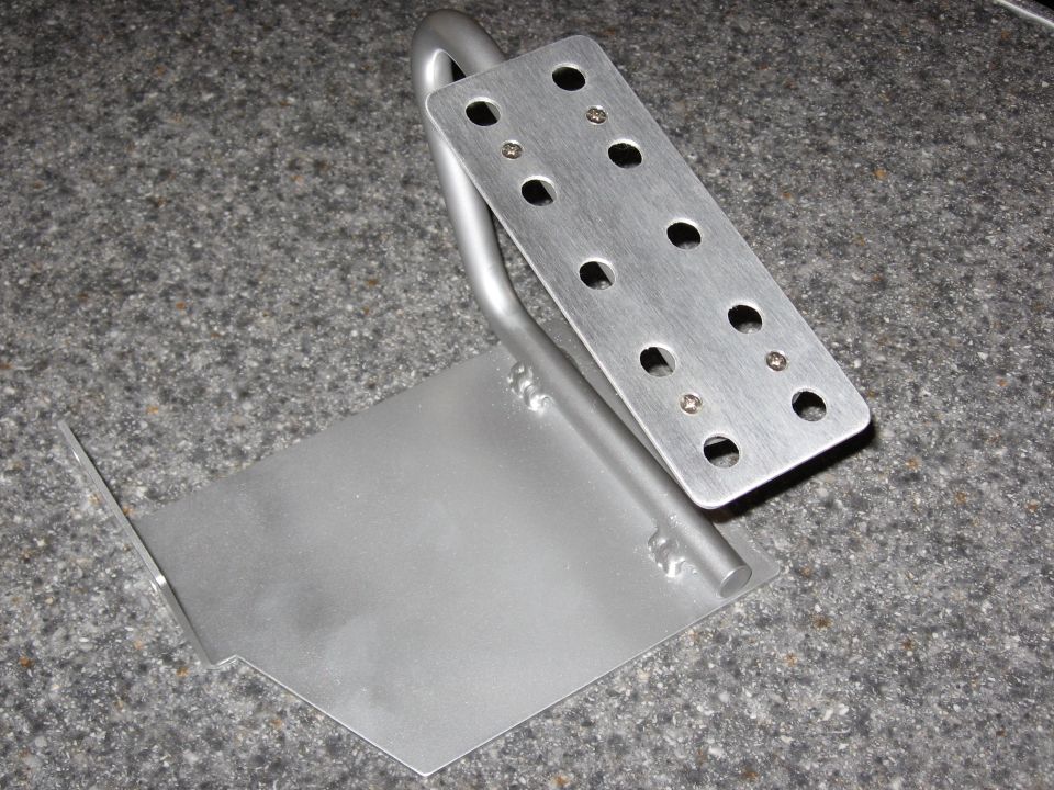 Fabricated metal gauge mounting bracket on a countertop