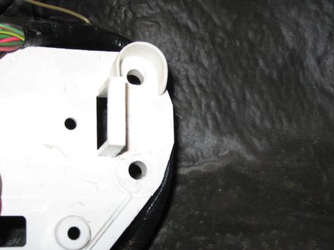 2001 Ford Crown Victoria - Step 5: Cut white bracket (after). I have yet to trim the lower edge of the bracket when this picture was taken. Trimming the lower edge al…