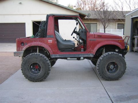 1987 Suzuki Samurai - This modified 1987 Suzuki Samurai is shown with its doors removed and oversized tires for off-road use.