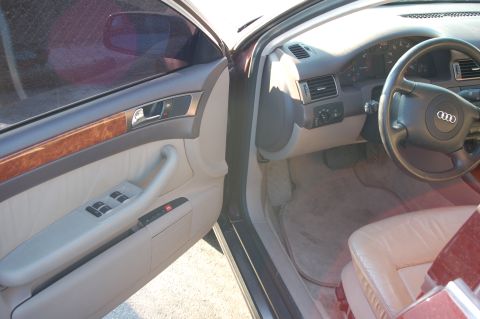 1993 Ford Bronco - Interior view of a car's driver side door, dashboard, and steering wheel.
