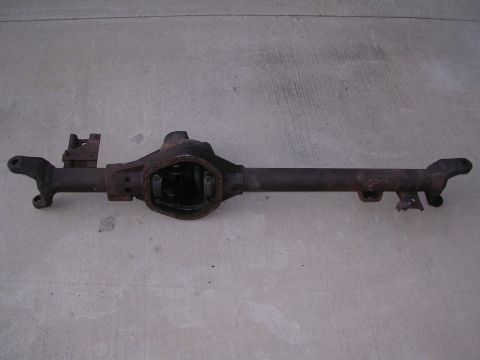 1999 Toyota Tacoma - A used rear axle assembly is shown from a side angle on a concrete surface.