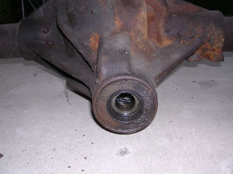 1999 Toyota Tacoma - Rusty differential housing shown from the side, with a bearing race in the center.