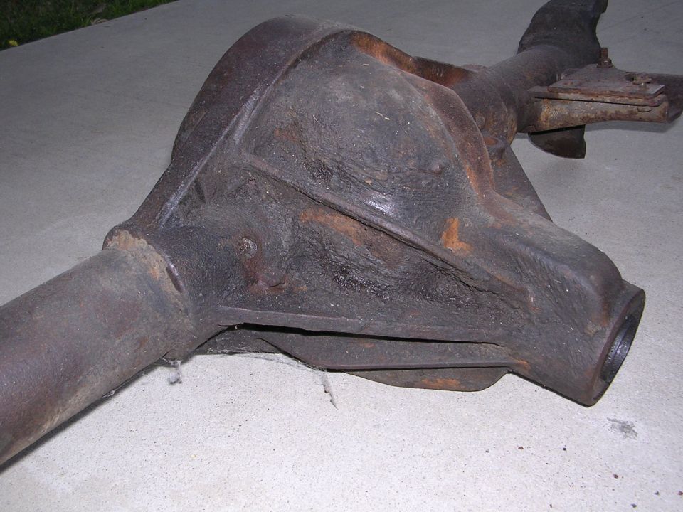 Rusty differential housing on concrete