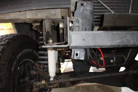 1996 Ford Bronco - Close-up view of vehicle undercarriage components, including suspension and frame structure.