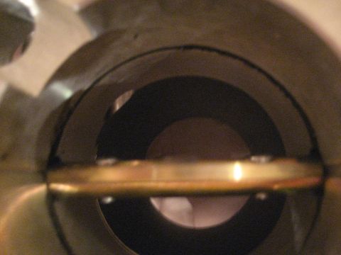 1989 Ford Bronco - Interior view of a throttle body, focusing on the butterfly valve mechanism.