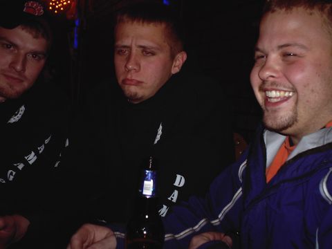 1994 Ford F-250 - Three men are gathered around a table, with one man laughing heartily.