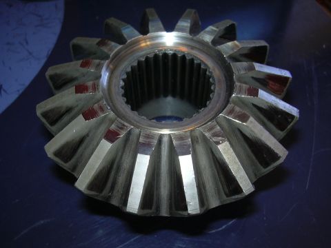 1996 Ford Crown Victoria - Close-up of a ring gear, likely for a differential, with visible wear marks on the teeth.