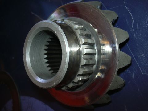 1996 Ford Crown Victoria - Close-up of a differential gear and pinion, showing the splined shaft and gear teeth.