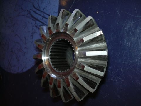1996 Ford Crown Victoria - A close-up view of a differential gear, showing its teeth and splined bore.