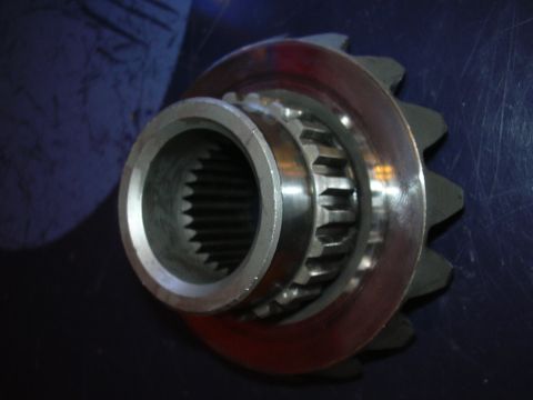 1996 Ford Crown Victoria - Close-up of a differential gear, showing its internal splines and external teeth.