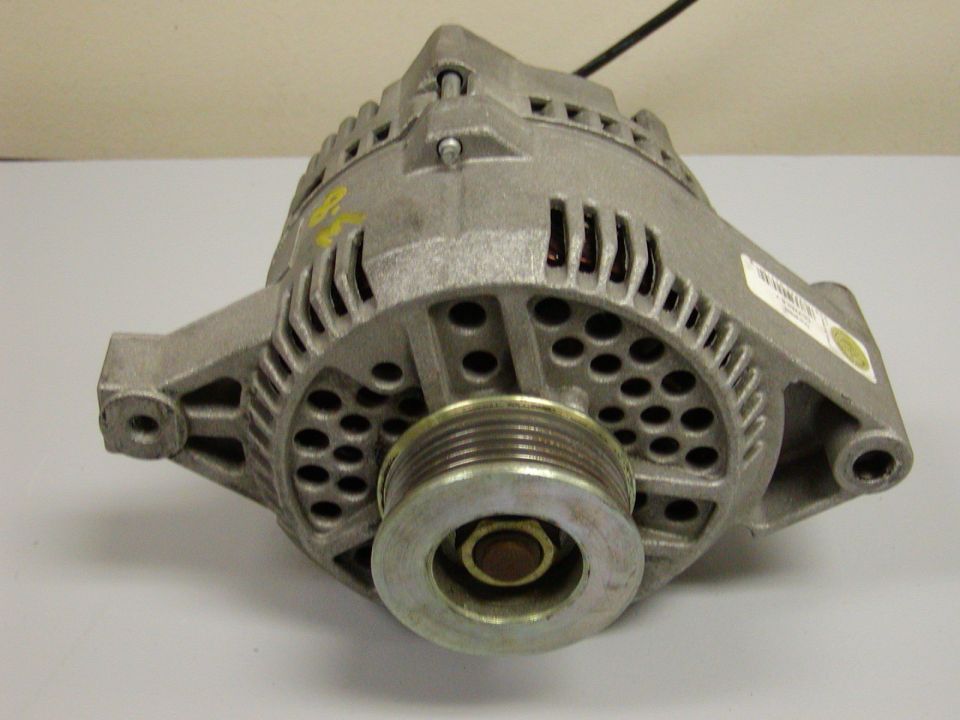 Automotive alternator with a pulley, showing vents and mounting points