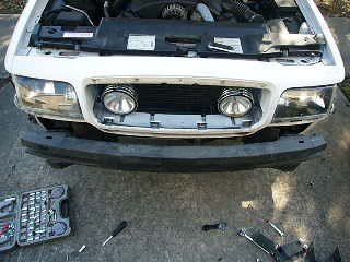 2000 Ford Crown Victoria - Front view of a 2000 Ford Crown Victoria with the push bumper removed, showing the grille and headlights.
