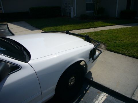 2000 Ford Crown Victoria - Front view of a white 2000 Ford Crown Victoria equipped with a Go Rhino push bumper.