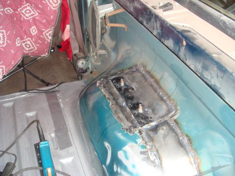 1996 Ford Bronco - Welding patch panels onto the interior floor of a 1996 Ford Bronco during rust repair.