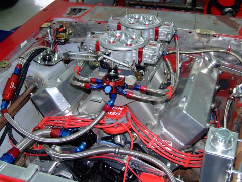 1990 Ford Mustang - Custom engine setup dual carburetors and performance fuel system components.