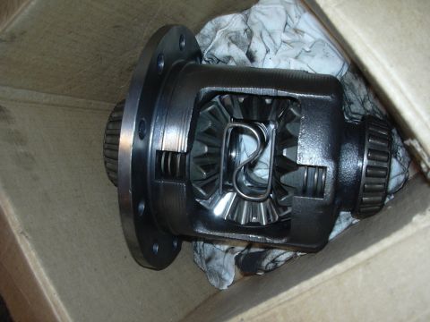 1996 Ford Crown Victoria - Close-up view of a differential part, showing internal gears and a bearing, placed within a cardboard box.