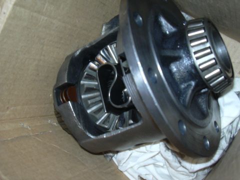 1996 Ford Crown Victoria - Close-up of a differential carrier assembly, showing gears and a bearing.