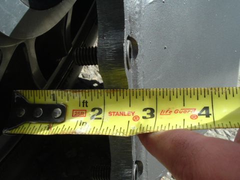 1989 Ford Bronco - A close-up shot shows a tape measure being used to measure a metal part, with the measurement around 3.5 inches.