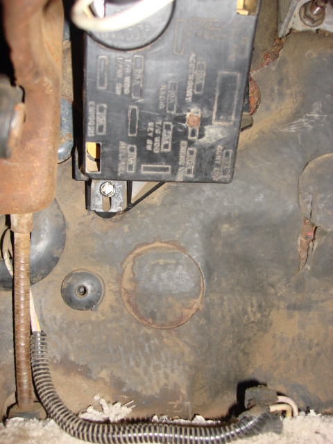1983 Ford Bronco - this is where the new harness will come thru (I hope). the wire harness on the bottom was for the High alt sensor. it is coming out as it i…