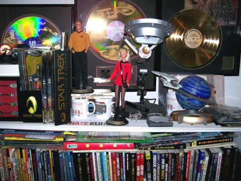 1966 Pontiac Fiero - Collection of Star Trek merchandise including figures, model ships, and framed discs.