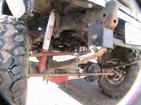 1977 Ford F-250 - Undercarriage view of a 1977 Ford F-250, highlighting its suspension and rear axle components.