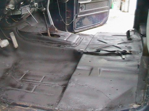 1977 Ford F-250 - The bare interior floor of a truck, ready for new treatment after some work.
