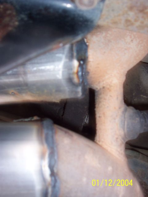 1994 Ford Bronco - Detail of a welded exhaust pipe, likely part of a custom exhaust system.