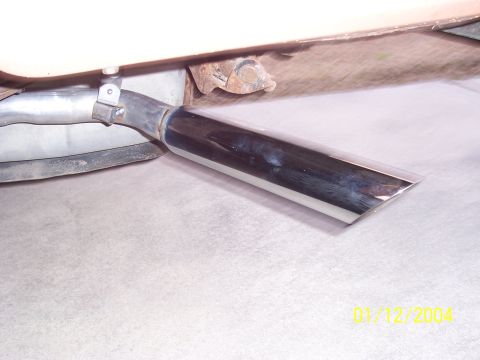 1994 Ford Bronco - A close-up view of a chrome exhaust tip, likely from a vehicle's exhaust system.