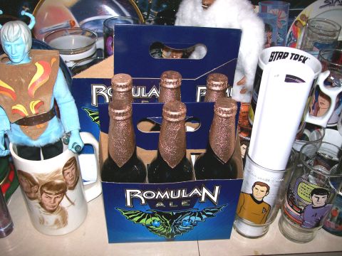 1966 Pontiac Fiero - A collection of Star Trek themed items including Romulan Ale, character glasses, and an action figure are displayed together.