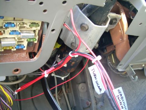 1988 Ford Bronco - Interior view of a vehicle's fuse box and wiring, showing labeled wires for turn signals and head switch.