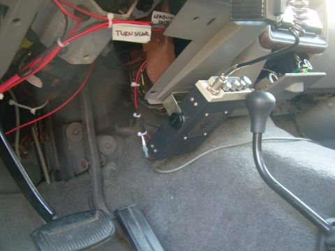1988 Ford Bronco - Close-up view of the interior of a vehicle, showing wiring, a CB radio, and labels for electrical components.