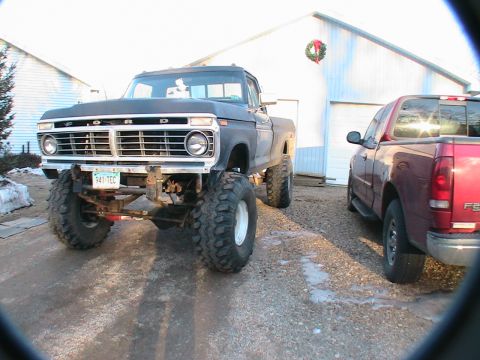 1977 Ford F-250 - Modified 1977 Ford F-250 pickup truck with oversized tires and a lifted suspension.
