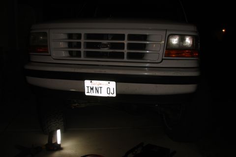 1996 Ford Bronco - Frontal view of a white Ford truck, focusing on the grille and bumper area.