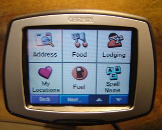 1991 Ford Probe - A Garmin GPS unit is shown, displaying its main menu with various navigation and utility options.