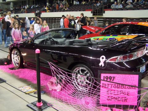 1994 Ford Probe - A black 1997 Mitsubishi Eclipse Spyder convertible is displayed with pink accents and spiderweb decorations.