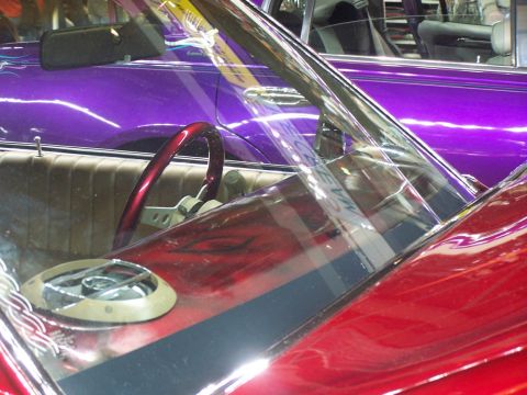 1994 Ford Probe - Close-up view of a red car's interior, with a purple car seen through the windshield.