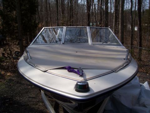 1985 Ford Bronco - Boat was just uncovered from the winter, thats why its a little dirty. Has a Mercury Force 70 motor on the back.