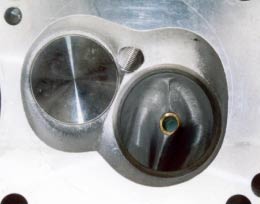 1972 Ford Ranchero - Close-up of an aluminum cylinder head, likely for a performance engine, with the Supermotors logo visible.