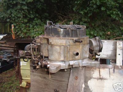 1972 Ford Ranchero - A close-up view of a used carburetor, showing its mechanical components and weathered exterior.